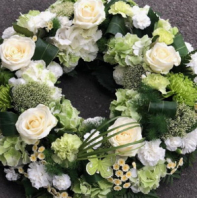 Creams Wreath ring - Cream and green flowers used to create this funeral piece